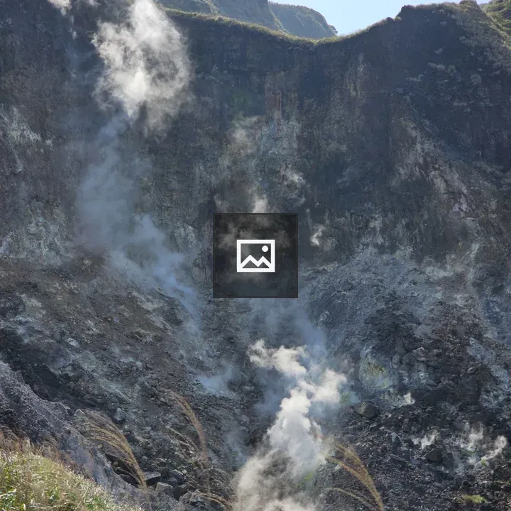 Volcano landscape with ash and steam
