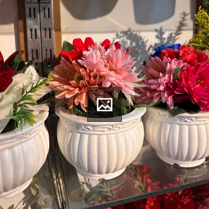 Vibrant artificial flowers in pots