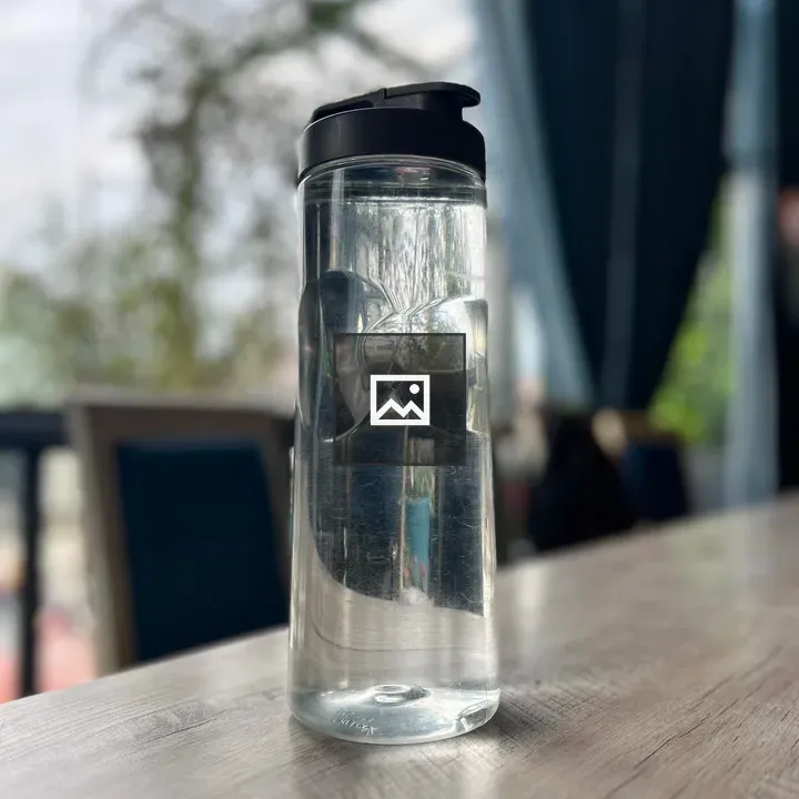 Transparent water mug on table