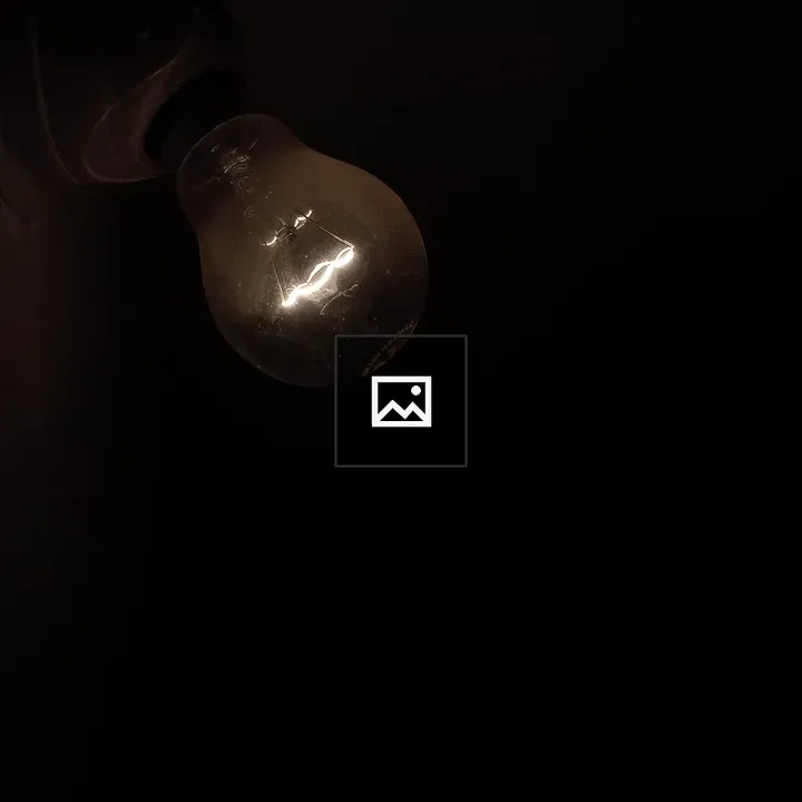 Light bulb in dark space