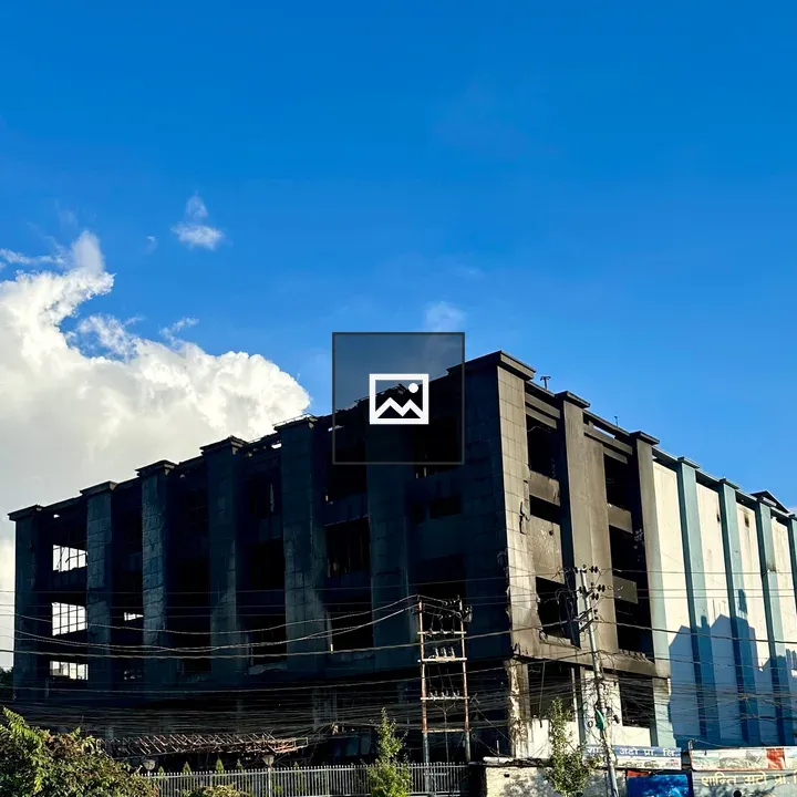 Burnt structure under blue sky