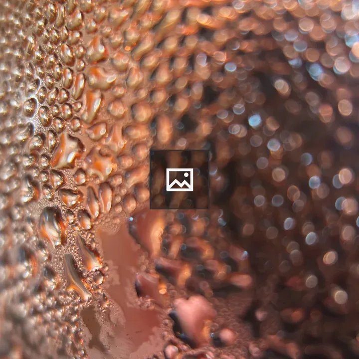 Closeup of Water Droplets on Copper Mug