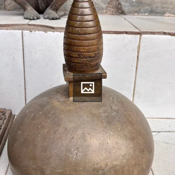 Bronze stupa on ceramic tiles