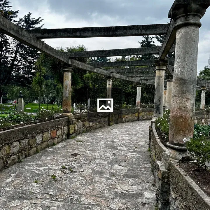Curved stone pergola walkway