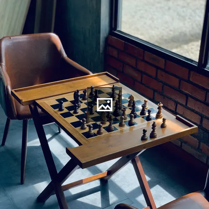 Chess board on table with chairs