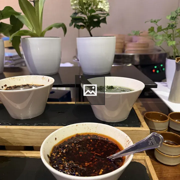 Wooden serving tray with three sauces