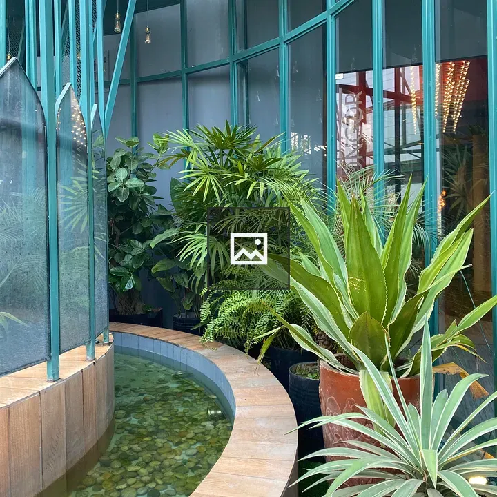 Indoor Garden with Teal Glass Walls