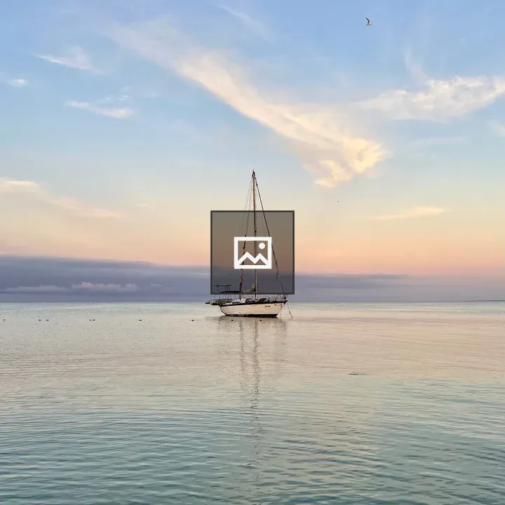White sailboat on calm water