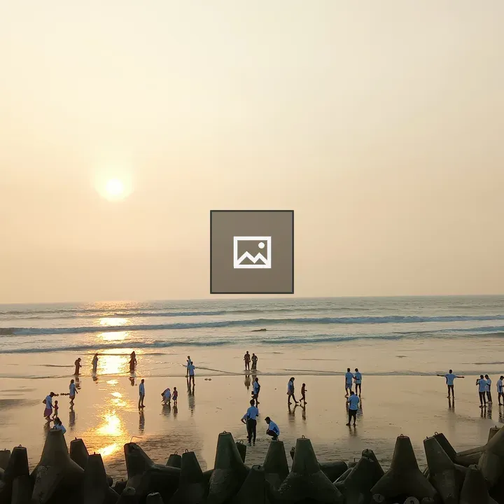 Beach sunset with walkers