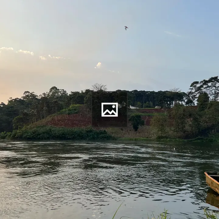 Peaceful river at sunset with boat