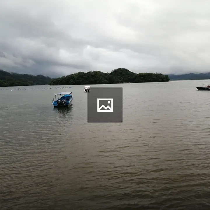 Calm Water with Boats and Hills