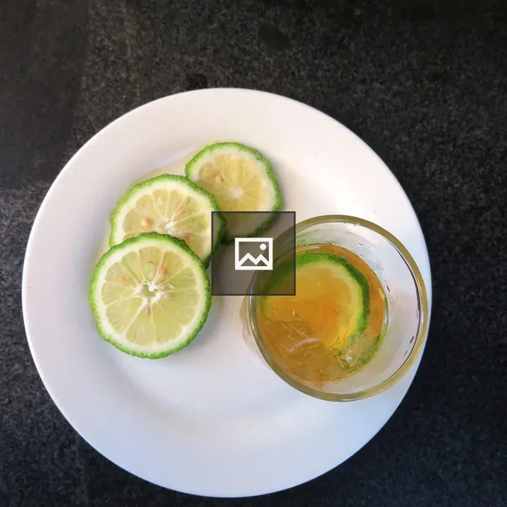 Green citrus on plate