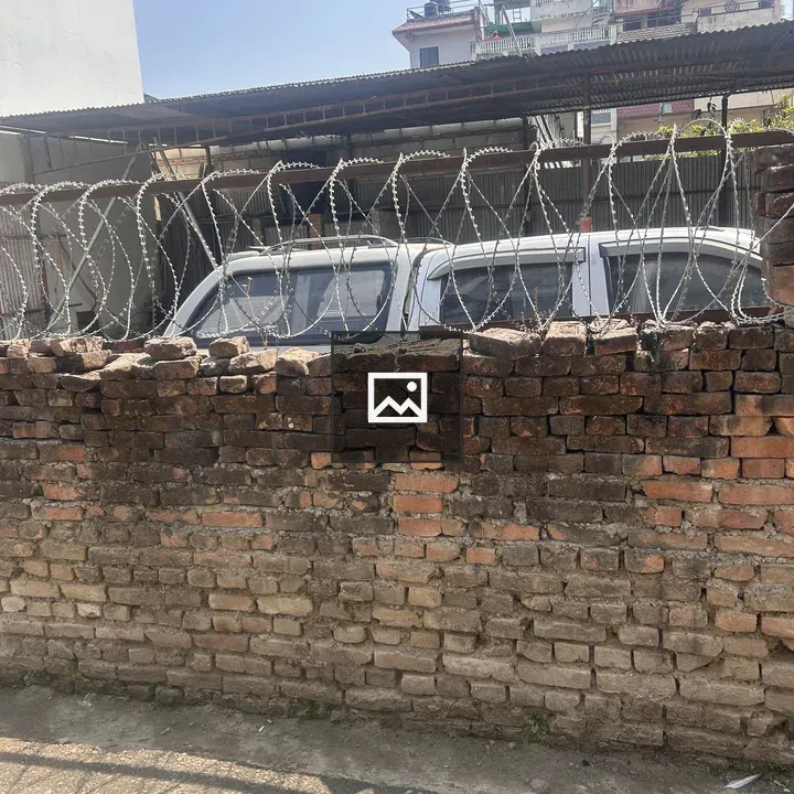 Brick Wall with Barbed Wire