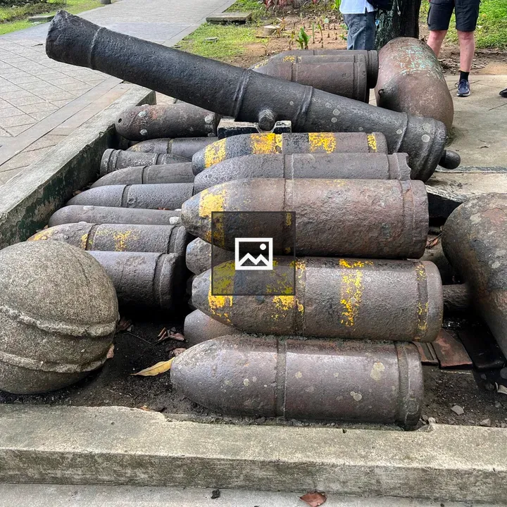 Antique artillery shells on concrete slab
