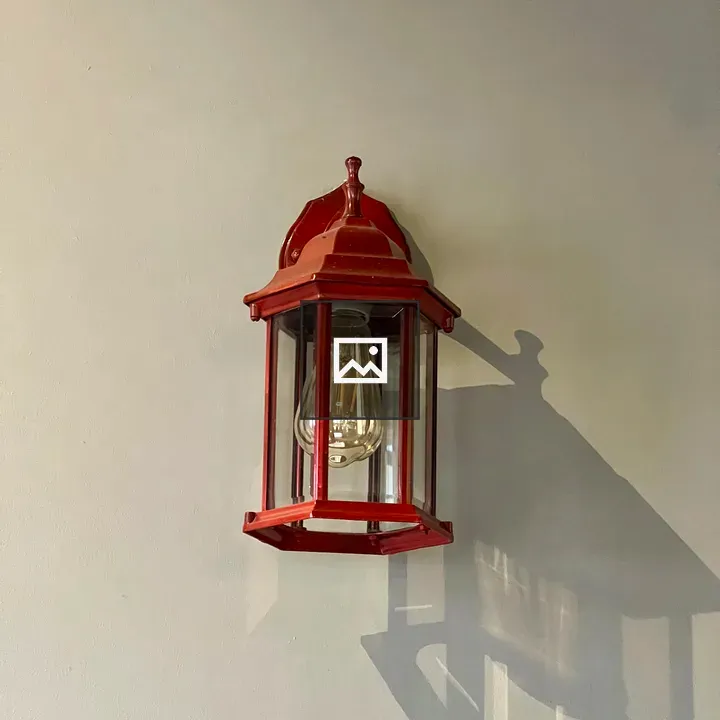 Vintage red lantern on gray wall
