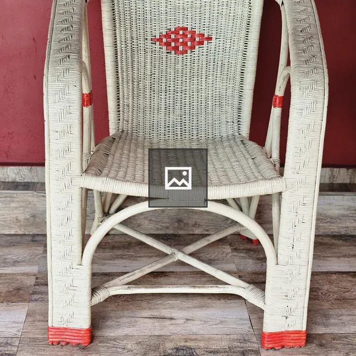 White wicker chair with red details