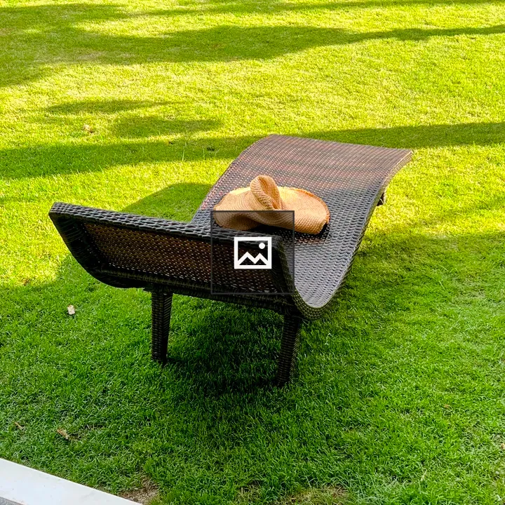 Straw Sun Hat on Lawn Chair