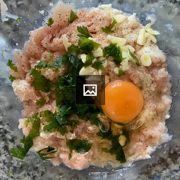 Minced chicken with egg in glass bowl