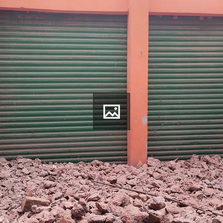 Rubble in Front of Broken Shop