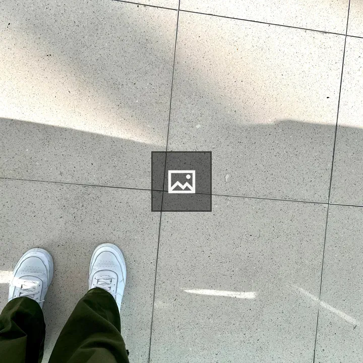 White Sneakers on Tile Floor