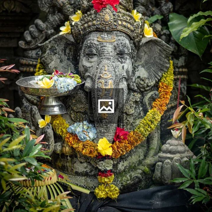 Ganesh statue with flowers
