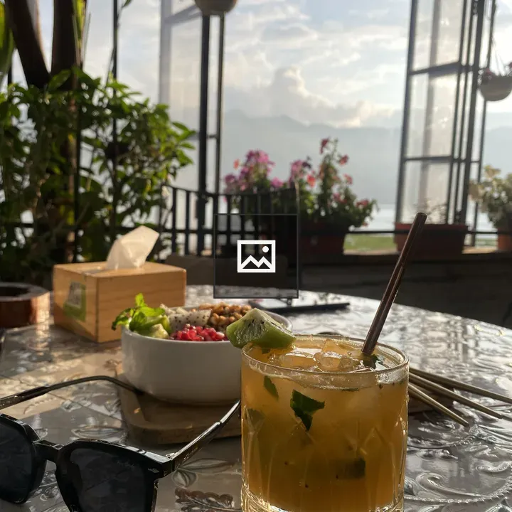 Iced drink on sunlit patio
