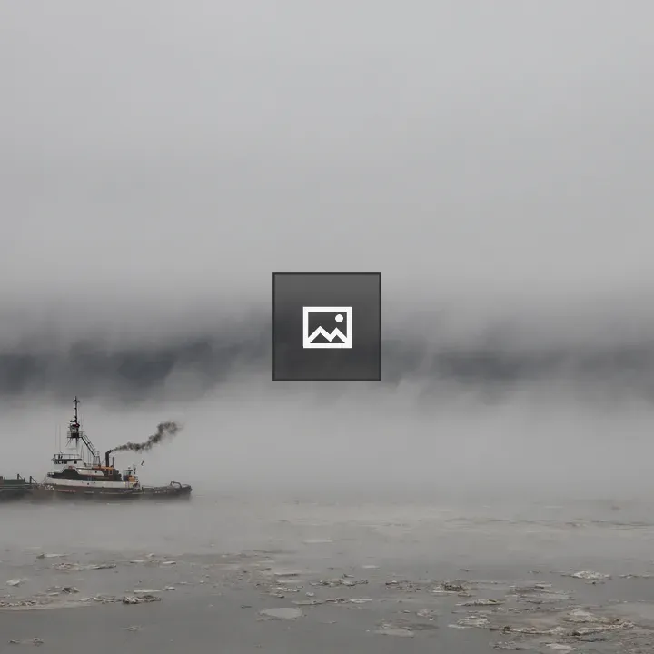 Tugboat on icy Hudson River
