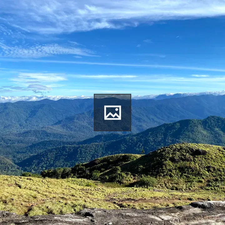 Green hills with clouds on horizon