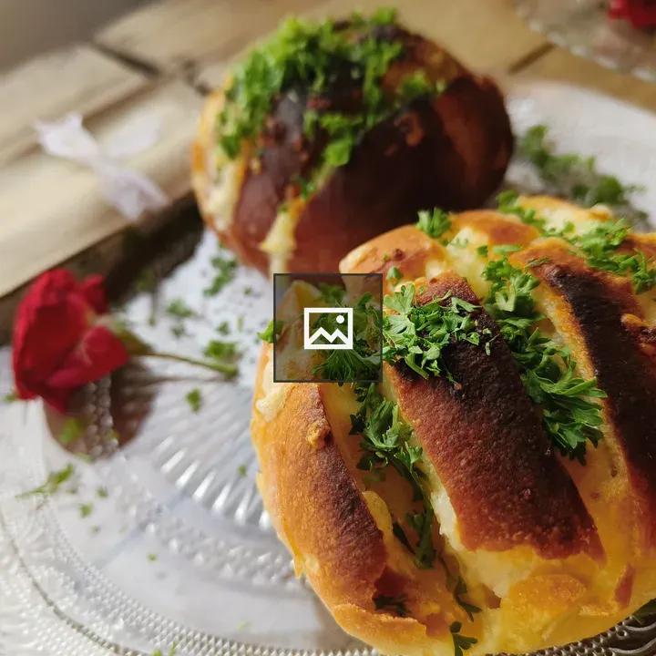 Two cheese-filled bread rolls