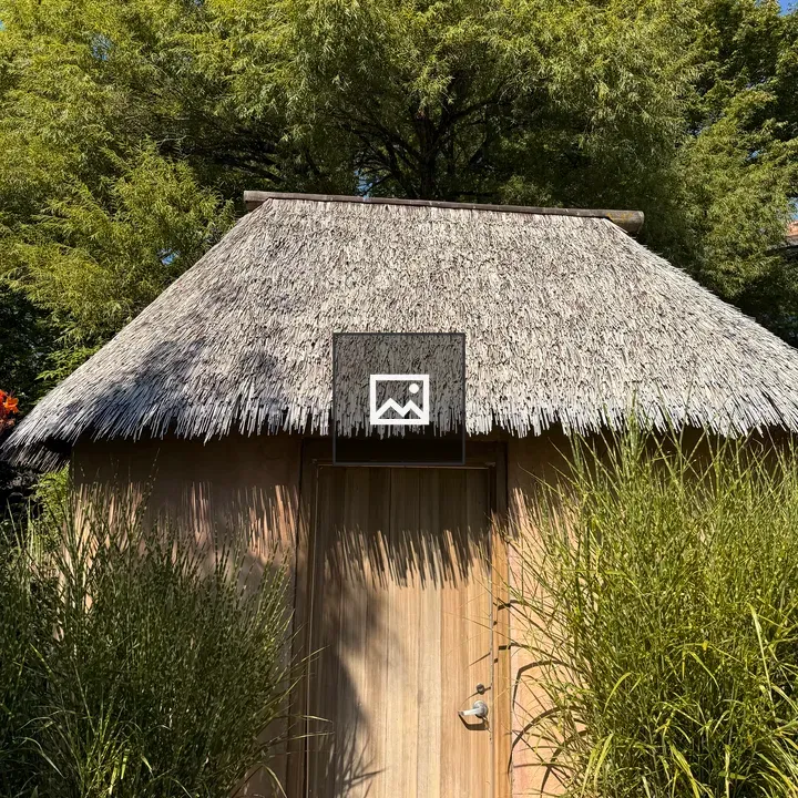 Small wooden hut with thatched roof