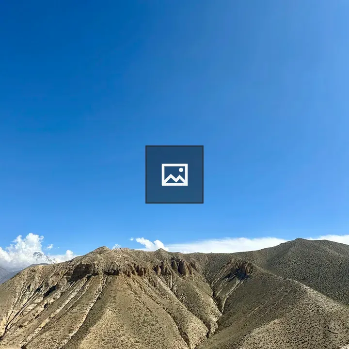 Expansive blue sky over mountains