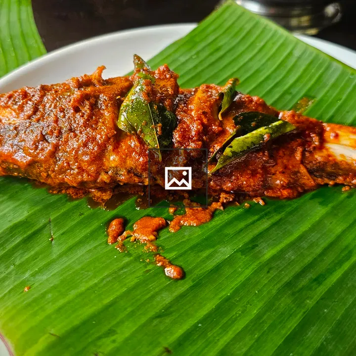 Kerala style fried fish on banana leaf