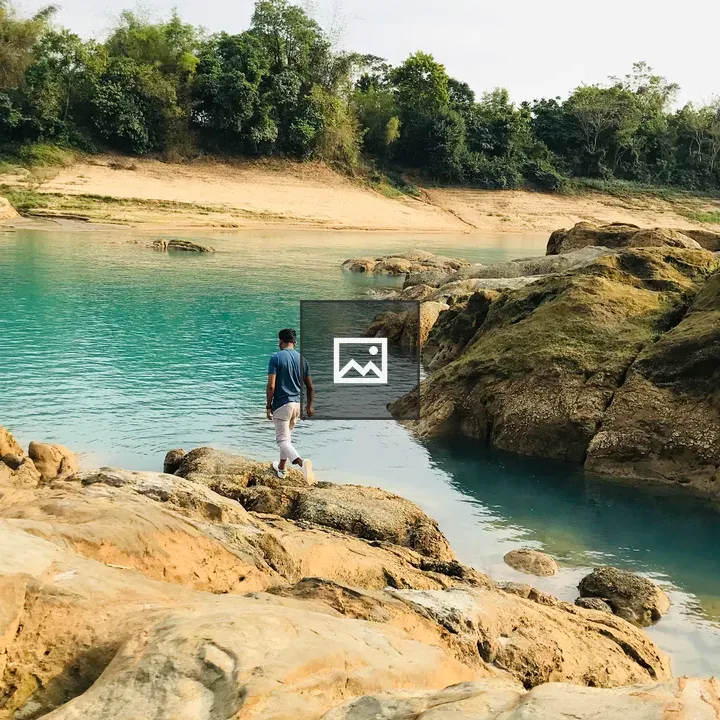 Boy Walking by Blue River