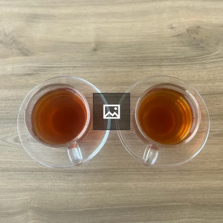 Two cups of tea on saucers