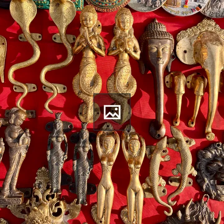 Door handles with Hindu iconography