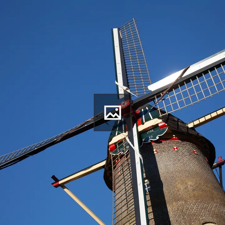 Windmill against blue sky