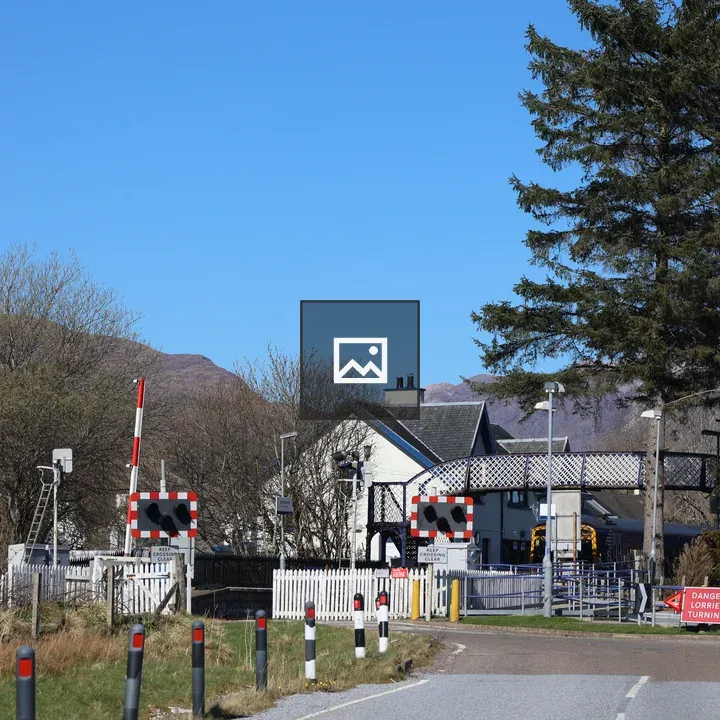 Railway crossing with small building