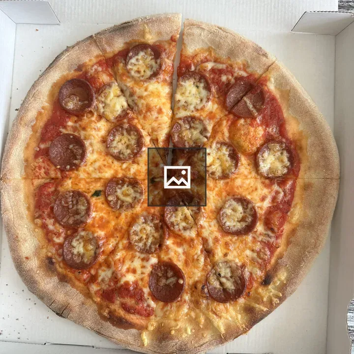 Chicken pizza slices on box