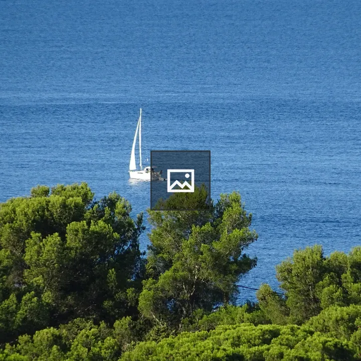 Sailboat on Calm Blue Sea