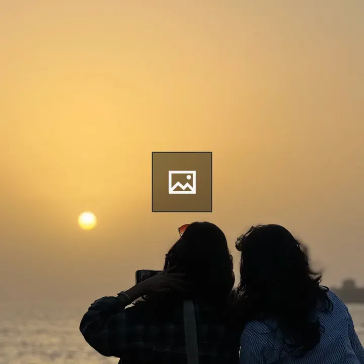 Sunset over Mumbai Marine Drive with two girls