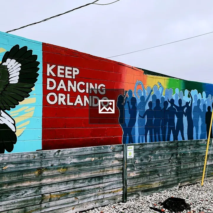 Mural with Bird and Rainbow Text