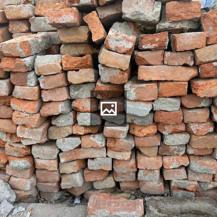 Stack of weathered red bricks