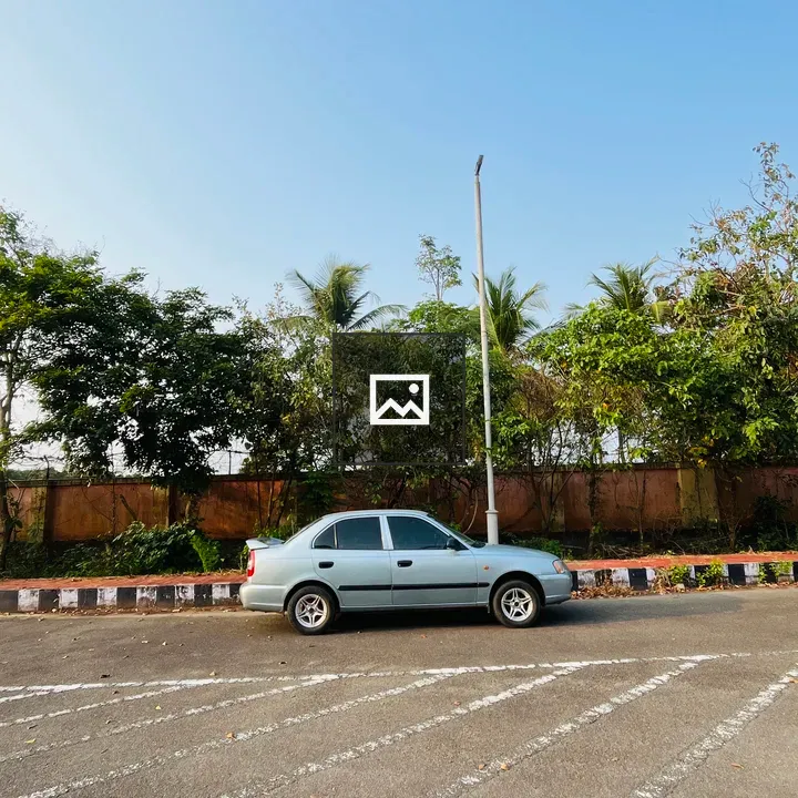 Silver Car in Parking Lot