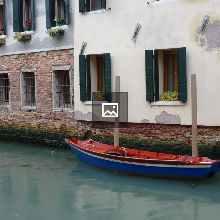 Blue and Red Boat on Venice Canal