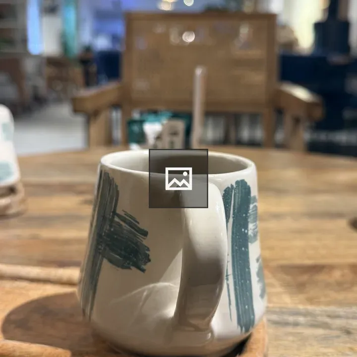 Ceramic mug on a wooden tray