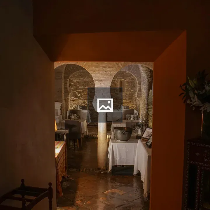 Cozy Restaurant Interior with Arched Walls