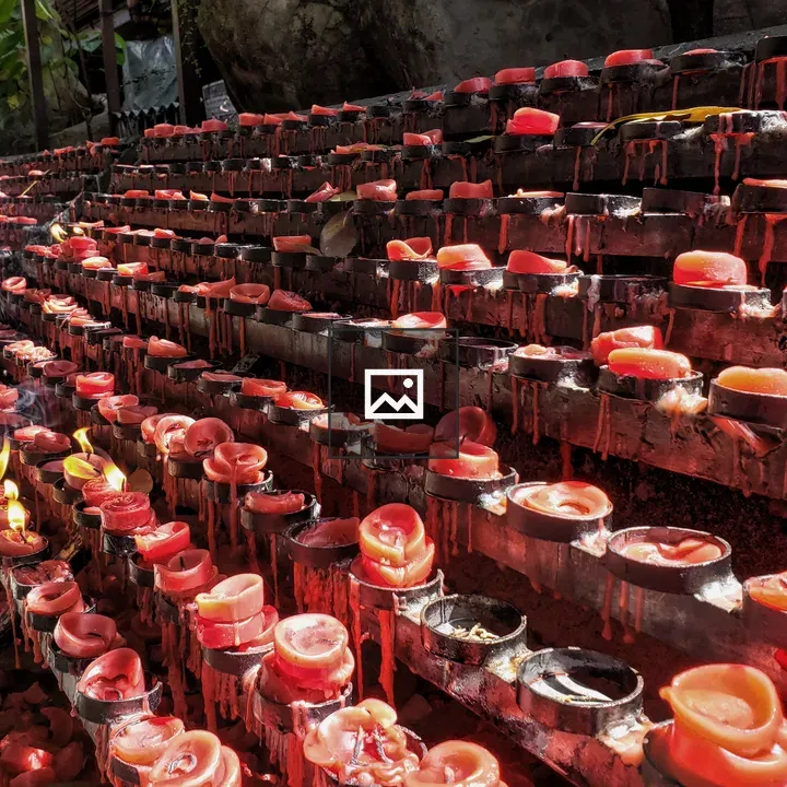 Red votive candles in a line