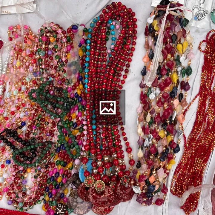 Bead necklaces on white surface