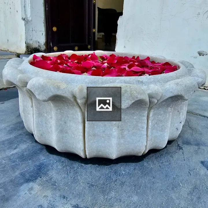 White marble bowl with rose petals