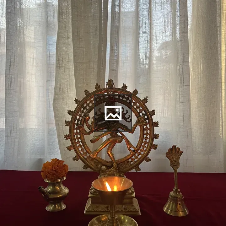 Statue of Nataraja on Red Table